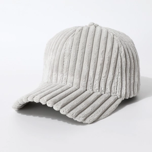 Close-up of light gray baseball cap with thick ribbed corduroy texture and curved brim