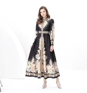Detailed close-up of the vintage paisley print and waist belt on this royal maxi dress