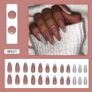 Almond French press-on nails with shimmering silver glitter tips in dusty rose pink