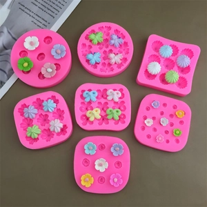 Assorted pink silicone molds for camellia flowers and bows cake baking decoration