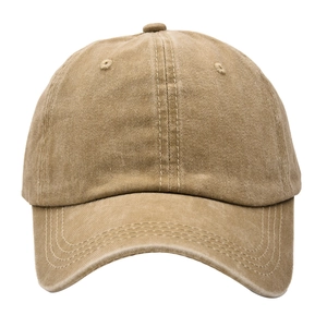 Detail of khaki washed cotton baseball cap showing six-panel crown and curved brim