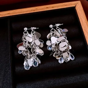 Elegant silver tassel earrings with blue water drop crystals in a premium velvet box