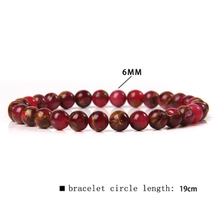 Detail view of 6mm red agate beads and 19cm elastic bracelet circle length