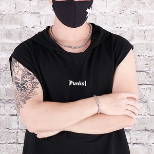 Silver square bone punk necklace and bracelet set shown on model with street style