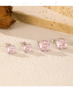 Macro shot of pink rose-cut cubic zirconia stud earrings in S925 sterling silver four-prong setting