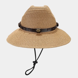 Detailed close-up of woven straw hat with brown leather band and metallic buckle details