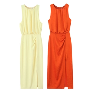 Detail of ruched sleeveless midi dress with side slit in yellow and orange
