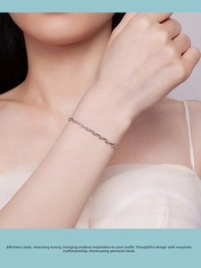 Close-up of a S925 sterling silver anchor chain bracelet worn on a woman's wrist