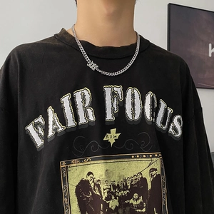 Hip hop titanium steel Cuban chain necklace paired with black Fair Focus graphic t-shirt