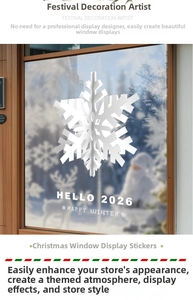 Detailed 3D white snowflake sticker with HELLO 2026 text on glass window display
