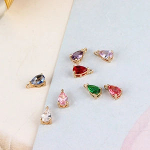 Set of eight gold-plated teardrop zircon charms for DIY jewelry making in various colors