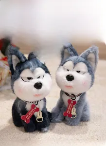 Detail of soft husky plush toy featuring a grumpy expression and a black collar with red tag