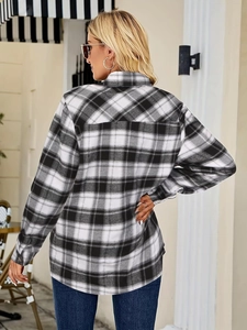 Back view of classic black and white plaid shirt with long sleeves and loose fit design