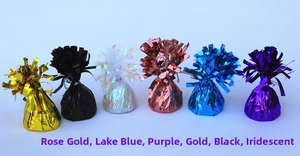 Close-up of colorful foil balloon weights in various metallic finishes for party decor