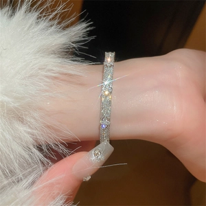 Macro detail of silver zircon flower bracelet featuring sparkling cubic zirconia stones