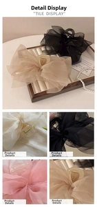 Macro view of mesh butterfly hair claw clips in beige, black, white, and pink chiffon