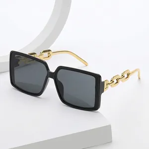 Classic black square oversized sunglasses with stylish gold chain metal temples on white