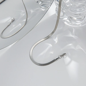Sleek silver flat snake chain necklace in titanium steel with water ripple light effect