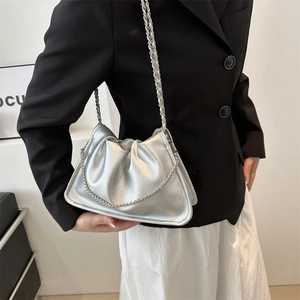 Chic silver pleated cloud shoulder bag with metallic finish and metal chain strap