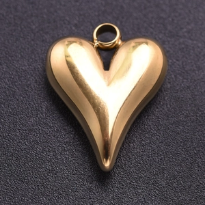 Macro shot of 304 gold stainless steel heart pendant with a polished metallic finish