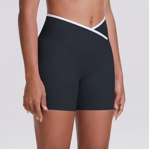 Detail of high waist cross V-waistband yoga shorts with white contrast binding