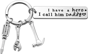 Detail of silver stainless steel keychain with Daddy hero text and small tool charms