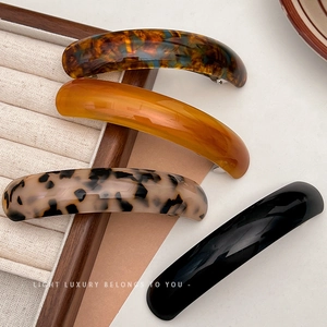 Elegant curved tortoiseshell and acetate spring hair barrettes in four stylish patterns