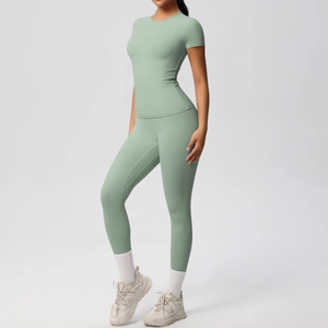 Close-up of mint green breathable two-piece yoga set with short sleeve top and leggings