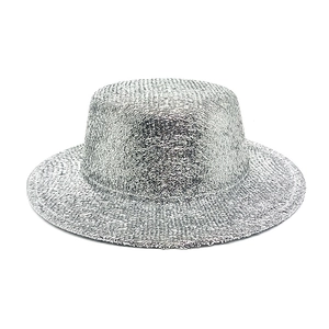 Close-up of a sparkling silver sequin flat-top boater hat with metallic finish for parties