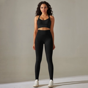 Detail view of black high-waist seamless yoga leggings and ribbed waistband texture