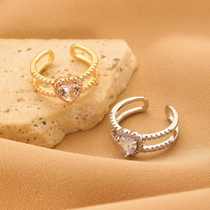Detail of adjustable heart-shaped zircon rings with micro-pave setting and dual bands