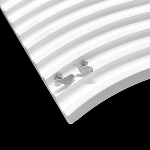 Macro view of silver bird-shaped titanium steel stud earrings on white wavy texture