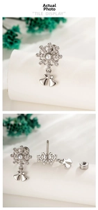 Macro detail of snowflake earrings with zircon pavé, pearl center and screw back closure