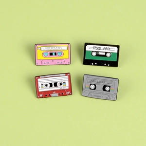 Set of four retro 90s cassette enamel pins made of zinc alloy in various colors