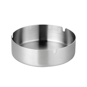 Durable round stainless steel ashtray in silver finish with three cigarette slots
