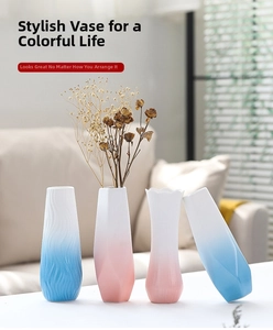 Detailed view of four modern ceramic vases with blue and pink gradient matte finish