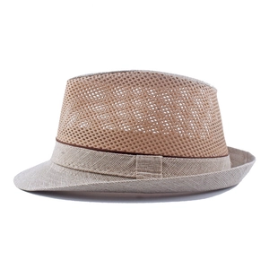 Macro detail of breathable mesh fabric and woven straw brim on this beige fedora hat