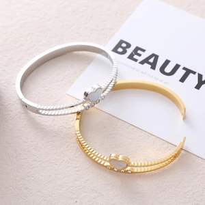 Chic heart-shaped open bangles in gold and silver steel with mother of pearl and zircons