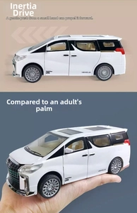 Detailed macro view of white MPV toy car showing inertial drive function and scale