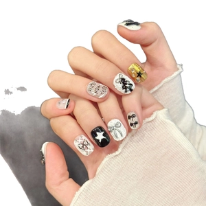 Christmas snowman press-on nails with 3D bows and Happy New Year holiday theme design