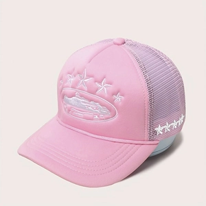 Detail of pink trucker hat featuring white embroidered stars and breathable mesh back