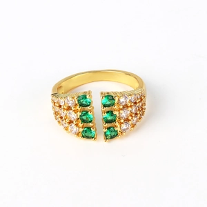 Detail of gold-plated open ring with micro-pave green and clear cubic zirconia gems