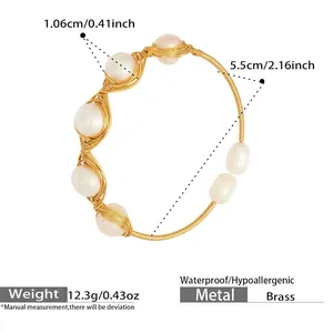 Detailed macro view of 18k gold brass wire hand-wrapped around white baroque pearls