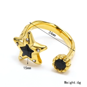 Retro gold star ring with black stones and measurements showing 24mm width and 15mm height