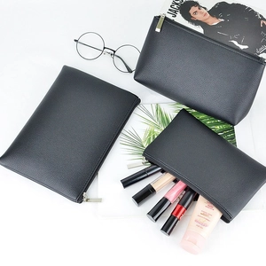 Three-piece black PU leather cosmetic bag set in various sizes for travel storage