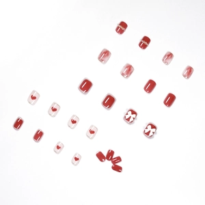 Short square press-on nails in rose red featuring 3D bows, rhinestones and heart patterns