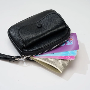Black lychee leather wristlet wallet with front snap pocket and large cash capacity