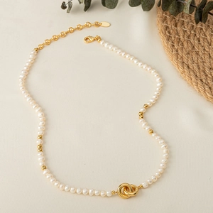 Elegant natural freshwater pearl choker with interlocking gold rings and lobster clasp