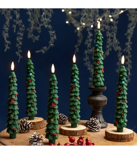 Close-up of green Christmas tree LED candles on wooden bases with festive bokeh lights