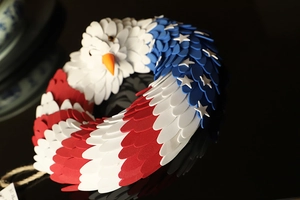 Macro shot of handcrafted patriotic eagle wreath with red white and blue stars